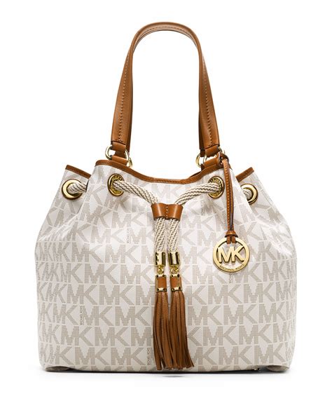 michael kors tan purse with tassles|Michael Kors beige bag.